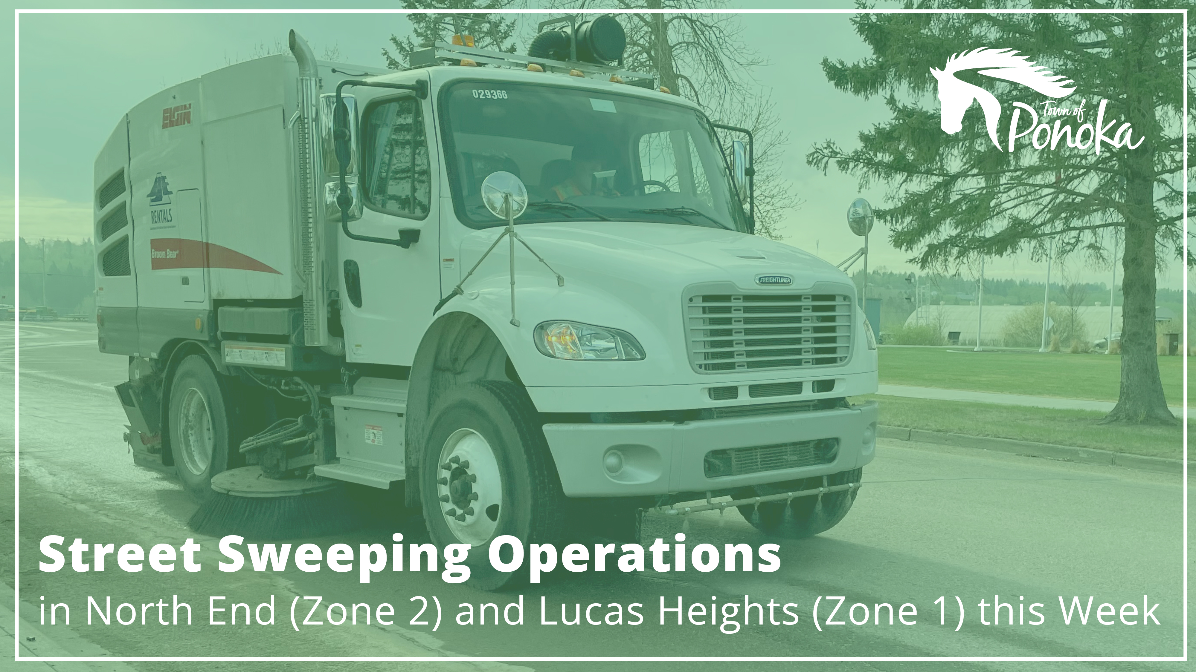 Street sweeper along the roadway.