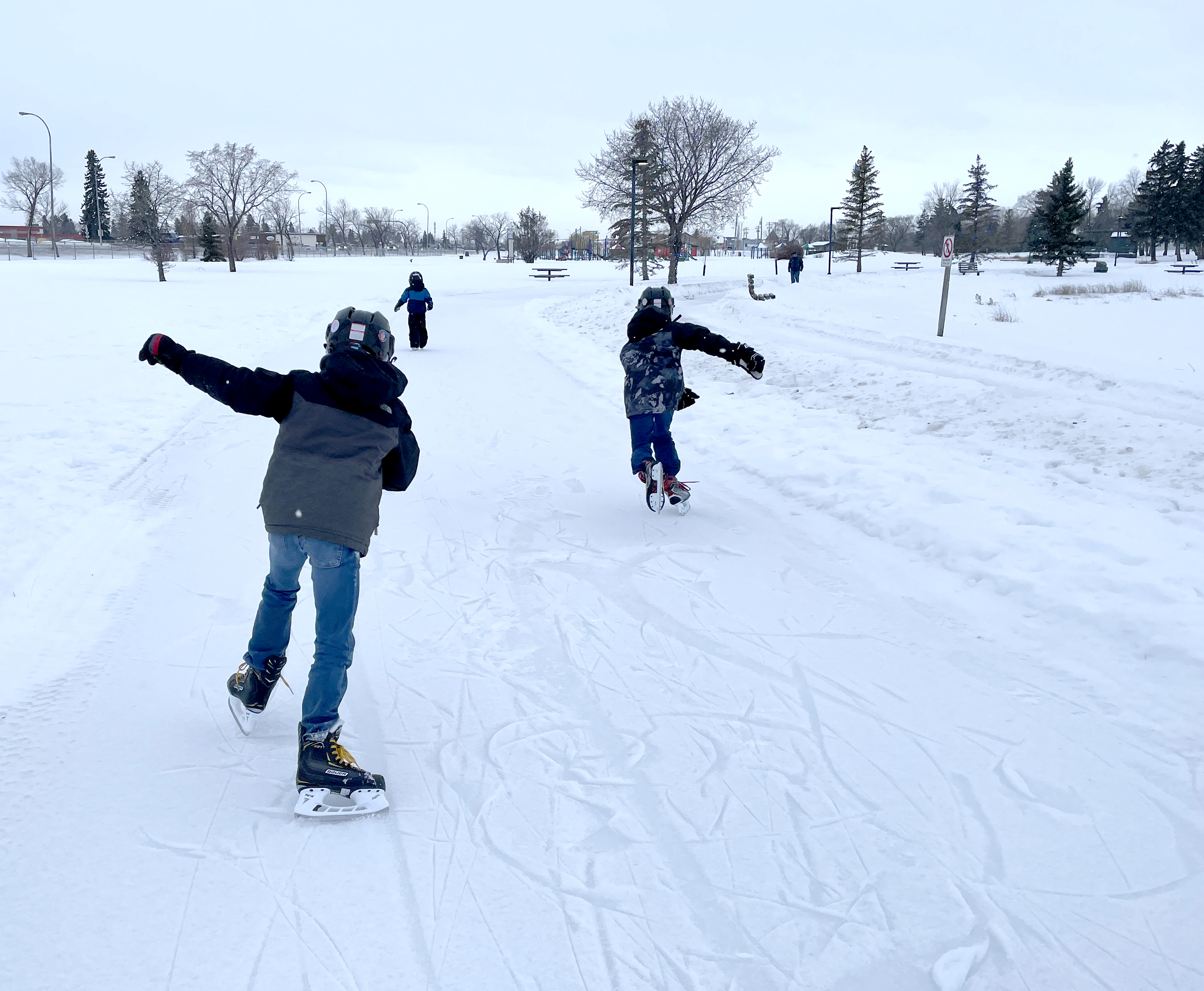 Kids skating along the trail