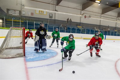 Kids hockey camp skating on the large ice surface